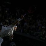 
              John Isner of the US serves to Britain's Andy Murray during their singles tennis match on day three of the Wimbledon tennis championships in London, Wednesday, June 29, 2022. (AP Photo/Alastair Grant)
            