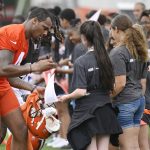 
              Cleveland Browns quarterback Deshaun Watson signs autographs after an NFL football practice at the team's training facility, Wednesday, June 1, 2022, in Berea, Ohio. (AP Photo/David Richard)
            