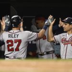 
              Atlanta Braves' Austin Riley is congratulated for his two-run home run against the Washington Nationals during the seventh inning of a baseball game Wednesday, June 15, 2022, in Washington. The Braves won 8-2. (AP Photo/Nick Wass)
            
