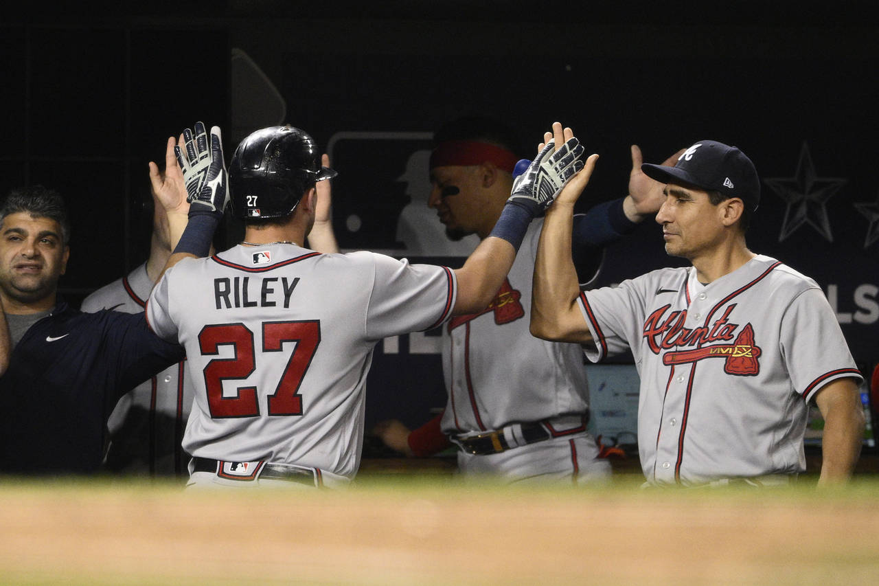 Atlanta Braves' Austin Riley is congratulated for his two-run home run against the Washington Natio...