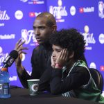 
              Boston Celtics center Al Horford, left, speaks next to his son, Ean, after the Celtics defeated the Golden State Warriors in Game 1 of basketball's NBA Finals in San Francisco, Thursday, June 2, 2022. (AP Photo/Jed Jacobsohn)
            