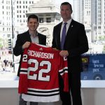 
              Chicago Blackhawks NHL hockey team general manager Kyle Davidson, left, and new head coach Luke Richardson hold up a jersey during a news conference in Chicago, Wednesday, June 29, 2022. Richardson becomes the 40th head coach Blackhawks history.(AP Photo/Nam Y. Huh)
            