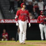 
              Los Angeles Angels designated hitter Shohei Ohtani (17) reacts after hitting a home run during the ninth inning of a baseball game against the Kansas City Royals in Anaheim, Calif., Tuesday, June 21, 2022. Mike Trout and Tyler Wade also scored. (AP Photo/Ashley Landis)
            