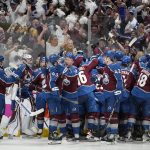 
              The Colorado Avalanche celebrate after an overtime win over Tampa Bay Lightning in Game 1 of the NHL hockey Stanley Cup Final on Wednesday, June 15, 2022, in Denver. (AP Photo/John Locher)
            