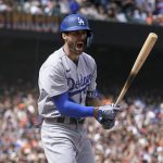 
              Los Angeles Dodgers' Chris Taylor reacts after striking out during the eighth inning of a baseball game against the San Francisco Giants in San Francisco, Sunday, June 12, 2022. (AP Photo/Jeff Chiu)
            