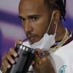 
              Mercedes driver Lewis Hamilton of Britain drinks during a press conference at the Silverstone race track in Silverstone, Thursday, June 30, 2022. The British F1 Grand Prix is held on Sunday July 3,2022. (AP Photo/Matt Dunham)
            