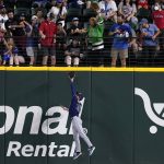 
              Tampa Bay Rays right fielder Brett Phillips leaps to make the catch on a fly ball by Texas Rangers' Kole Calhoun during the first inning of a baseball game Wednesday, June 1, 2022, in Arlington, Texas. (AP Photo/Tony Gutierrez)
            