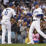 
              Los Angeles Dodgers' Justin Turner, left, congratulates Los Cody Bellinger for his two-run home run against the New York Mets during the second inning of a baseball game Friday, June 3, 2022, in Los Angeles. (AP Photo/John McCoy)
            