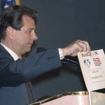 
              FILE - Alan I. Rothenberg, chairman, president and CEO of World Cup USA 1994, holds up a card reading "Chicago Soldier Field," at a news conference in New York, March 23, 1992, where the nine sites for soccer's 1994 World Cup were announced. As FIFA prepares to announce the 2026 World Cup sites on Thursday — and make high-profile cuts — Alan Rothenberg thought back to when stadiums were picked for the 1994 tournament he headed in the United States. (AP Photo/Osamu Honda, File)
            