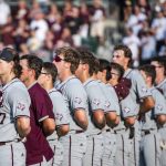 
              The Texas A&M baseball team remove their caps for the national anthem before they face TCU in an NCAA college baseball tournament regional game Sunday, June 5, 2022, in College Station, Texas. (Meredith Seaver/College Station Eagle via AP)
            