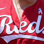 
              A powder-blue ribbon is displayed on the uniform of Cincinnati Reds first baseman Joey Votto in honor of Father's Day during a baseball game against the Milwaukee Brewers, Sunday, June 19, 2022, in Cincinnati. (AP Photo/Jeff Dean)
            