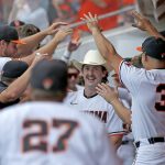 
              Oklahoma State's Nolan McLean (13) gets ready to celebrate a home run in the fourth inning against Missouri State during an NCAA college baseball tournament regional game in Stillwater, Okla., Friday, June 3, 2022. (Sarah Phipps/The Oklahoman via AP)
            