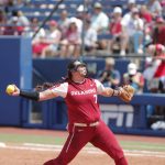 
              Oklahoma's Hope Trautwein (7) pitches in the second inning of an NCAA softball Women's College World Series elimination game against UCLA on Monday, June 6, 2022, in Oklahoma City. (AP Photo/Alonzo Adams)
            