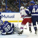 
              Tampa Bay Lightning goaltender Andrei Vasilevskiy (88) falls on a shot by New York Rangers center Ryan Strome (16) during the first period in Game 3 of the NHL hockey Stanley Cup playoffs Eastern Conference finals Sunday, June 5, 2022, in Tampa, Fla. Defending for Tampa Bay is Jan Rutta (44).(AP Photo/Chris O'Meara)
            