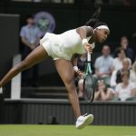 
              Coco Gauff of the US serves to Romania's Mihaela Buzarnescu in a second round women's singles match on day four of the Wimbledon tennis championships in London, Thursday, June 30, 2022. (AP Photo/Kirsty Wigglesworth)
            