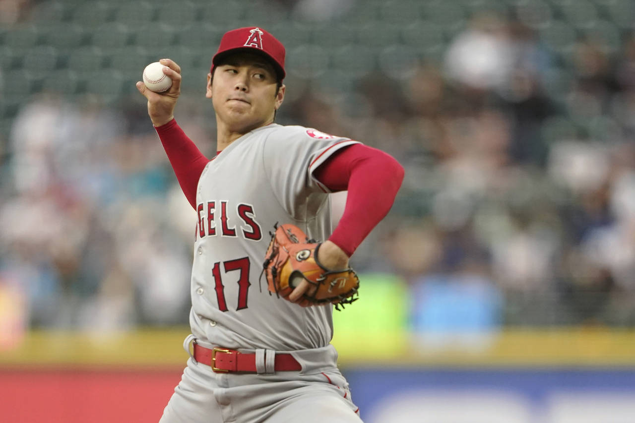 Los Angeles Angels' Shohei Ohtani throws against the Seattle Mariners during the fourth inning of a...