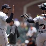 
              Detroit Tigers starting pitcher Rony García (51) high-fives catcher Eric Haase (13) after escaping a bases-loaded jam against the San Francisco Giants during the third inning of a baseball game, Wednesday, June 29, 2022, in San Francisco. (AP Photo/D. Ross Cameron)
            