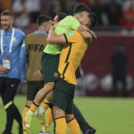
              Australian players celebrate after winning in a penalty shoot-out during the World Cup 2022 qualifying play-off soccer match between Australia and Peru in Al Rayyan, Qatar, Monday, June 13, 2022. (AP Photo/Hussein Sayed)
            