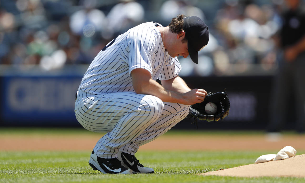 New York Yankees starting pitcher Gerrit Cole (45) pauses before pitching against the Houston Astro...