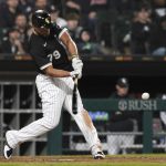 
              Chicago White Sox's Jose Abreu singles against the Los Angeles Dodgers during the sixth inning of a baseball game Tuesday, June 7, 2022, in Chicago. (AP Photo/Charles Rex Arbogast)
            