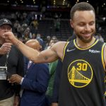 
              Golden State Warriors guard Stephen Curry (30) celebrates after beating the Boston Celtics in Game 4 of basketball's NBA Finals, Friday, June 10, 2022, in Boston. (AP Photo/Steven Senne)
            
