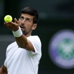 
              Serbia's Novak Djokovic practices on Center Court ahead of the 2022 Wimbledon Championship at the All England Lawn Tennis and Croquet Club, in London, Thursday, June 23, 2022. (Steven Paston/PA via AP)
            