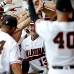 
              Oklahoma State's Nolan McLean (13) celebrates a home run in the second inning against Missouri State during an NCAA college baseball tournament regional game in Stillwater, Okla., Friday, June 3, 2022. (Sarah Phipps/The Oklahoman via AP)
            