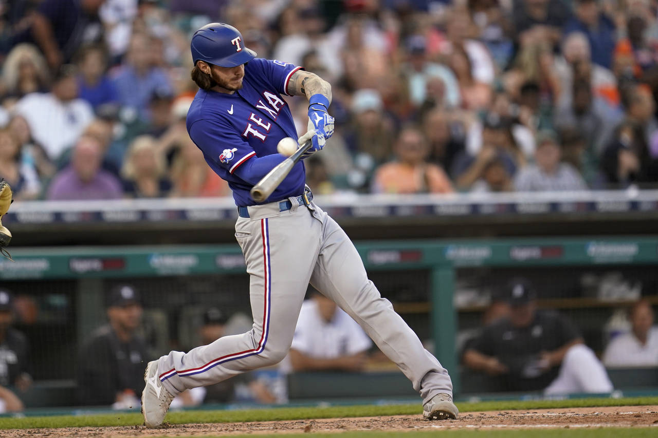 Texas Rangers' Jonah Heim hits a home run against the Detroit Tigers in the fifth inning of a baseb...