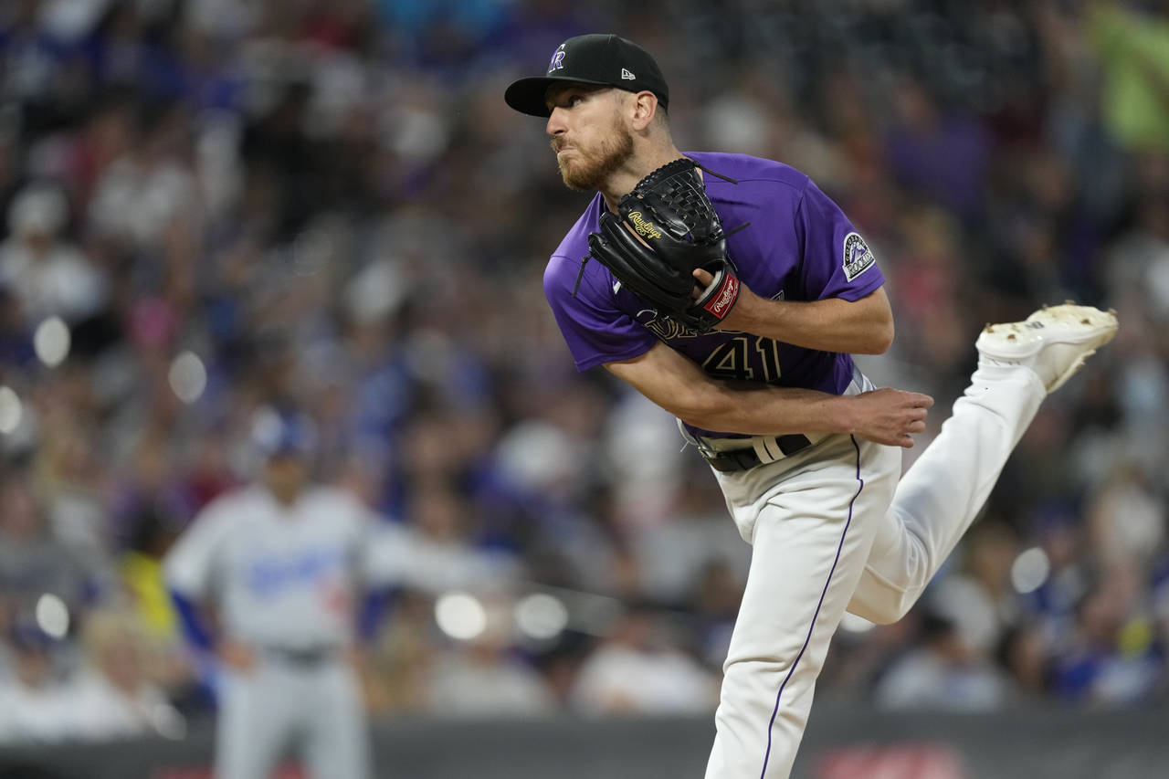 Colorado Rockies starting pitcher Chad Kuhl works against the Los Angeles Dodgers during the eighth...