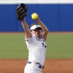 
              Northwestern's Danielle Williams pitches in the first inning of an NCAA softball Women's College World Series game against UCLA on Friday, June 3, 2022, in Oklahoma City. (AP Photo/Alonzo Adams)
            