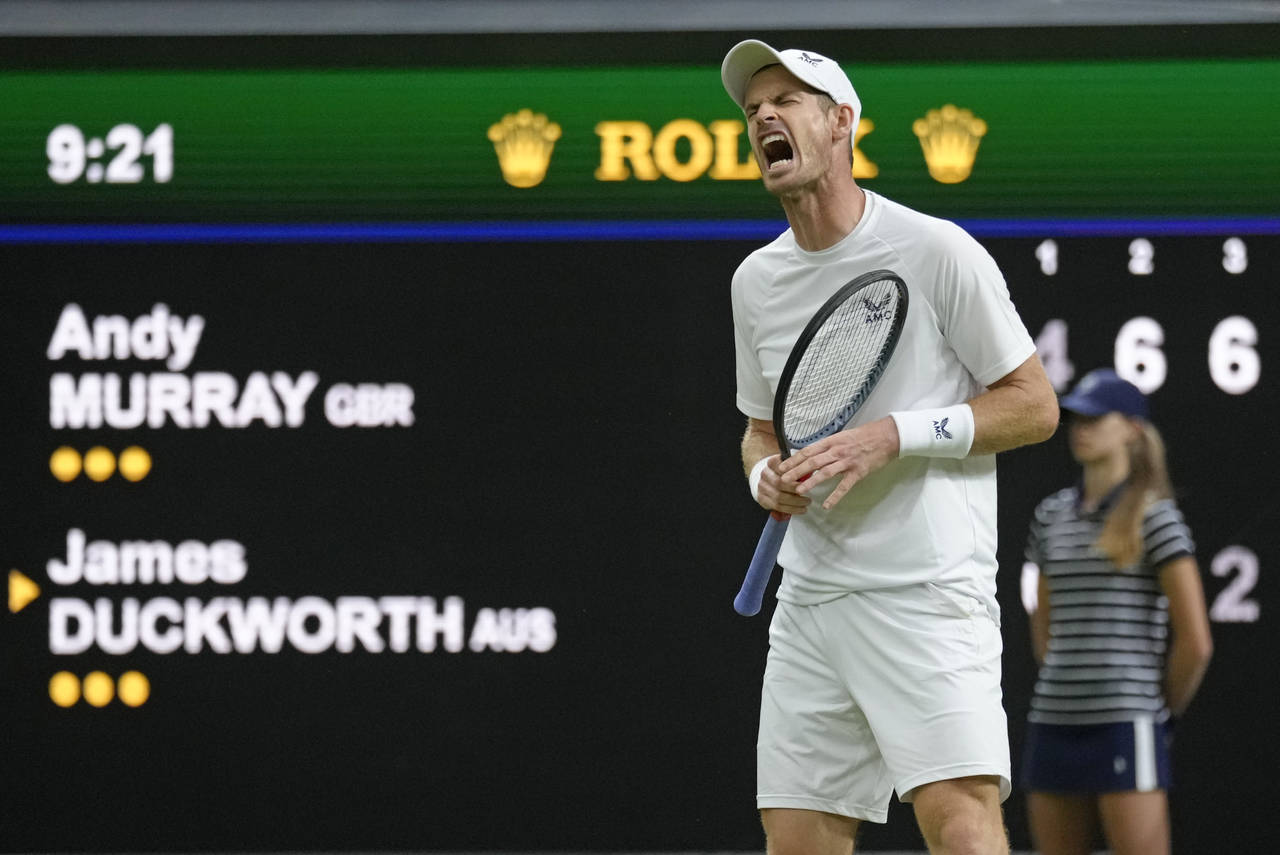 Britain's Andy Murray reacts after losing a point against Australia's James Duckworth in a first ro...
