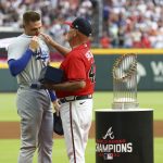 
              Atlanta Braves manager Brian Snitker, right, presents former Braves first baseman Freddie Freeman with his World Series Championship ring during Freeman's return to Atlanta with the Los Angles Dodgers for a baseball game Friday, June 24, 2022, in Atlanta. (Curtis Compton/Atlanta Journal-Constitution via AP)
            