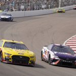
              Joey Logano (22) races alongside Denny Hamlin (11) during a NASCAR Cup Series auto race at World Wide Technology Raceway, Sunday, June 5, 2022, in Madison, Ill. Logano ended up winning the race. (AP Photo/Jeff Roberson)
            