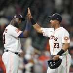 
              Houston Astros' Michael Brantley (23) and Yordan Alvarez celebrate after a baseball game against the Seattle Mariners Tuesday, June 7, 2022, in Houston. The Astros won 4-1. (AP Photo/David J. Phillip)
            
