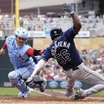 
              Tampa Bay Rays' Randy Arozarena scores against Minnesota Twins catcher Ryan Jeffers (27) during the fourth inning of a baseball game, Sunday, June 12, 2022, in Minneapolis. (AP Photo/Stacy Bengs)
            