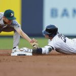 
              New York Yankees' Josh Donaldson (28) beats the tag of Oakland Athletics second baseman Nick Allen on a double during the first inning of a baseball game Tuesday, June 28, 2022, in New York. (AP Photo/Noah K. Murray)
            