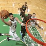 
              Boston Celtics forward Jayson Tatum (0) goes up for a shot against Golden State Warriors forward Draymond Green (23) during the second half of Game 3 of basketball's NBA Finals, Wednesday, June 8, 2022, in Boston. (Kyle Terada/Pool Photo via AP)
            