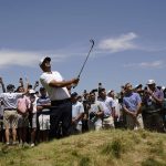 
              Brooks Koepka watches his shot on the 17th hole during the second round of the U.S. Open golf tournament at The Country Club, Friday, June 17, 2022, in Brookline, Mass. (AP Photo/Charlie Riedel)
            