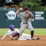 
              Texas A&M's Ryan Targac makes the out at second base during an NCAA college baseball tournament regional game against TCU Sunday, June 5, 2022, in College Station, Texas. (Meredith Seaver/College Station Eagle via AP)
            