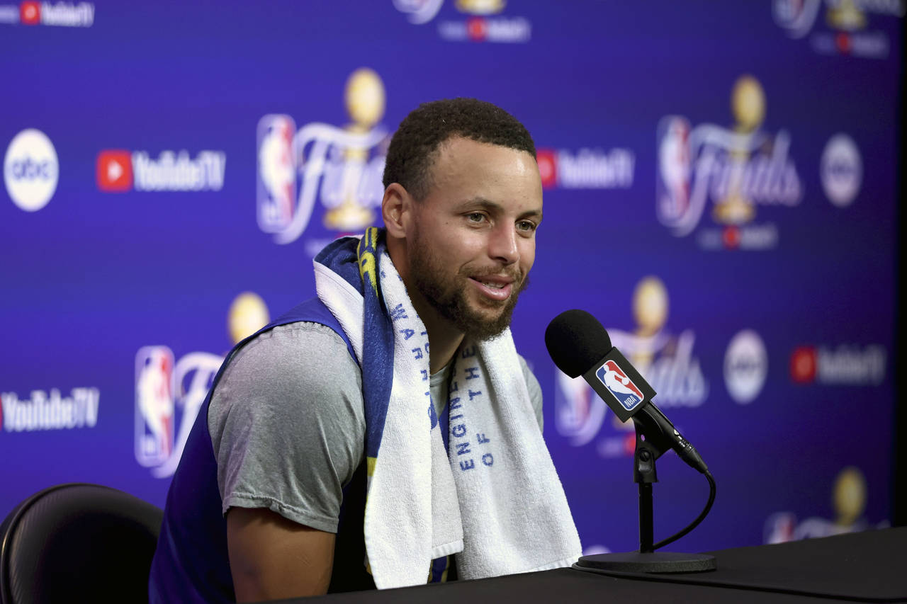 Golden State Warriors guard Stephen Curry speaks to members of the media during NBA basketball prac...