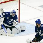 
              Colorado Avalanche left wing Artturi Lehkonen, bottom, shoots the puck past Tampa Bay Lightning goaltender Andrei Vasilevskiy (88) for a goal during the second period of Game 6 of the NHL hockey Stanley Cup Finals on Sunday, June 26, 2022, in Tampa, Fla. (AP Photo/John Bazemore)
            