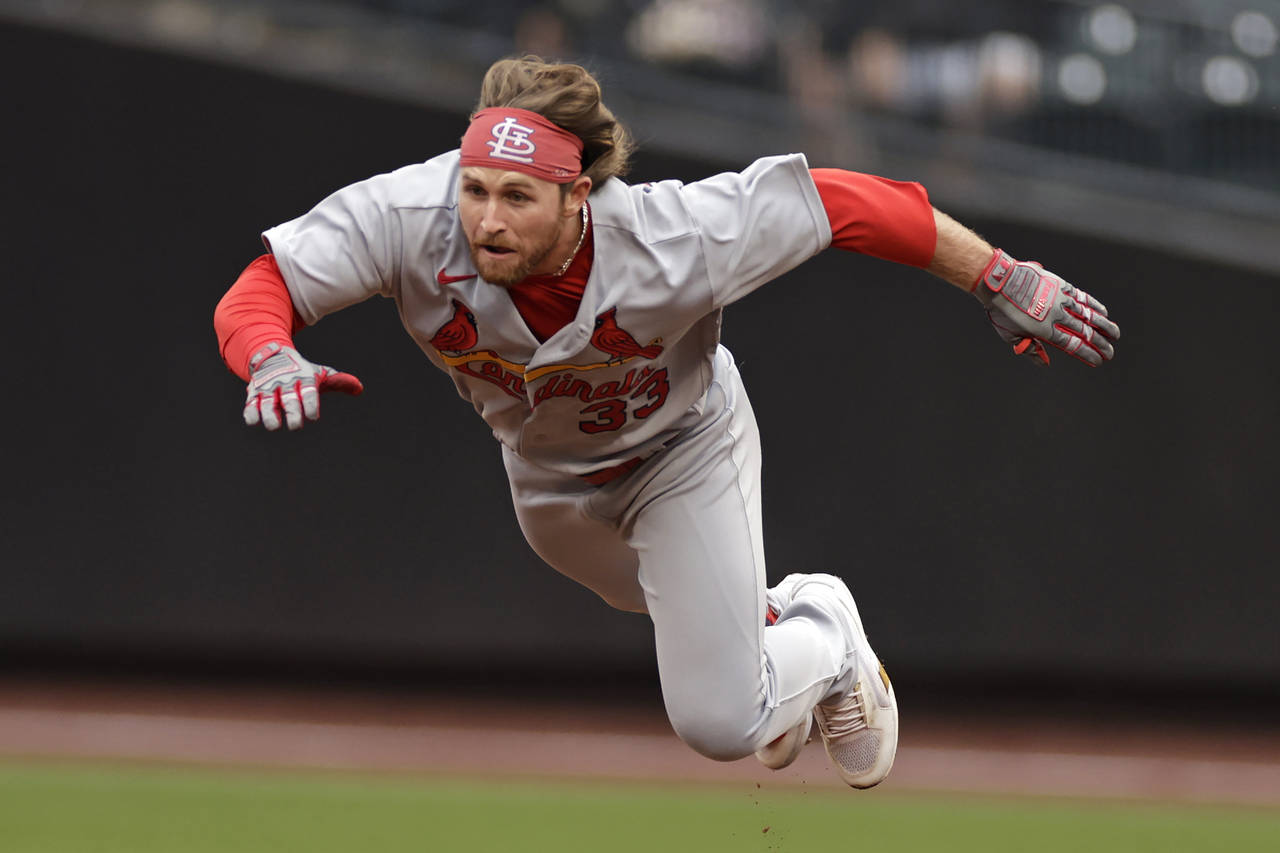 St. Louis Cardinals' Brendan Donovan dives safely into second base during the first inning of a bas...
