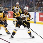 
              Hamilton Bulldogs' Nathan Staios (44) gets around Shawinigan Cataractes' Jacob Lafontaine (28) during second-period Memorial Cup hockey game action in Saint John, New Brunswick, Monday, June 27, 2022. (Ron Ward/The Canadian Press via AP)
            