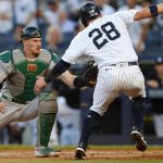 
              Oakland Athletics catcher Sean Murphy tags out New York Yankees' Josh Donaldson (28) during the first inning of a baseball game Tuesday, June 28, 2022, in New York. (AP Photo/Noah K. Murray)
            