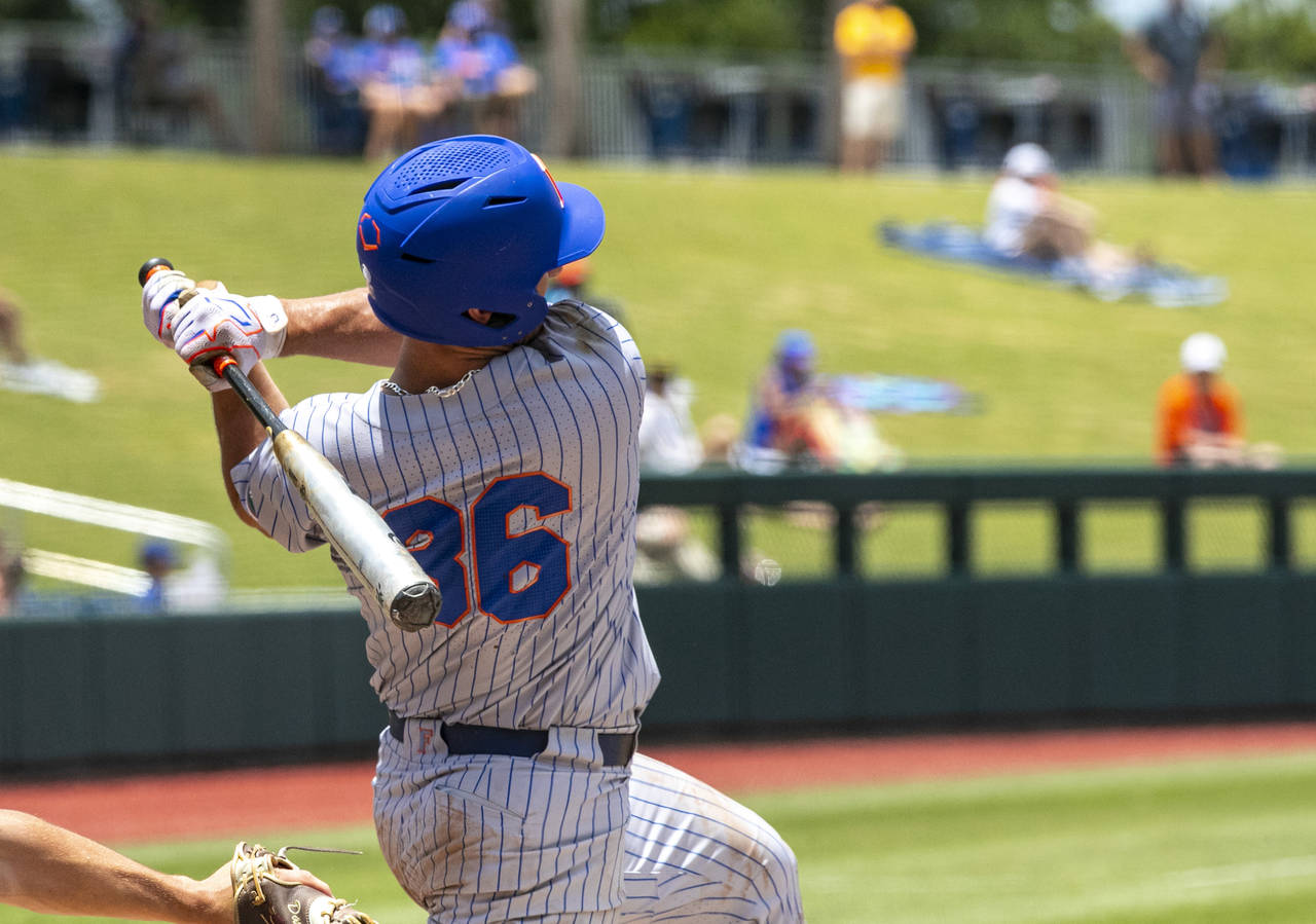 Florida's utility Wyatt Langford (36) with a home run against Central Michigan during an NCAA colle...