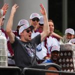
              Colorado Avalanche defenseman Devon Toews cheers during a rally for the Stanley Cup NHL hockey champions Thursday, June 30, 2022, in Denver. (AP Photo/Jack Dempsey)
            