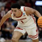 
              FILE - Wisconsin's Johnny Davis dribbles during the second half of a first-round NCAA college basketball tournament game against Colgate on March 18, 2022, in Milwaukee. Davis is a lottery prospect and one of the top wings in this year's NBA draft. (AP Photo/Morry Gash, File)
            