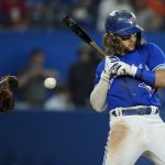 
              Toronto Blue Jays' Bo Bichette (11) moves off the plate on an inside pitch as Baltimore Orioles catcher Robinson Chirinos (23) makes the catch during the sixth  inning of a baseball game in Toronto on Thursday, June 16, 2022. (Nathan Denette/The Canadian Press via AP)
            