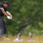 
              Phil Mickelson hits on the fourth hole during the first round of the U.S. Open golf tournament at The Country Club, Thursday, June 16, 2022, in Brookline, Mass. (AP Photo/Robert F. Bukaty)
            