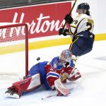 
              Edmonton Oil Kings goaltender Sebastian Cossa, left, makes a save on Shawinigan Cataractes' Charles Beaudoin during the first period of the Memorial Cup hockey game in Saint John, New Brunswick,  Tuesday, June 21, 2022. (Darren Calabrese/The Canadian Press via AP)
            